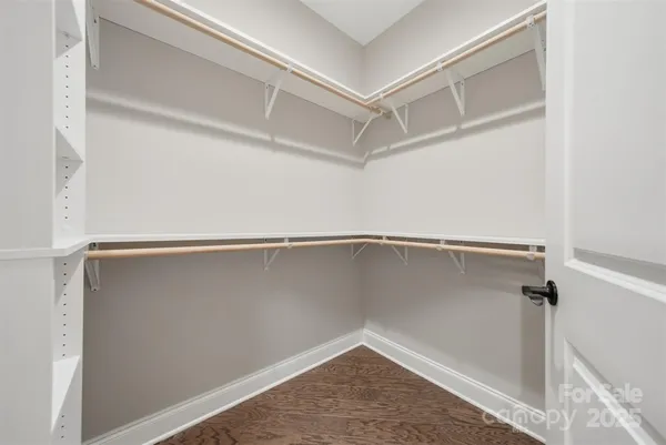 a view of an empty walk in closet