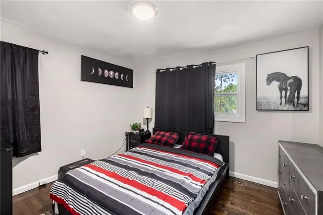 a bedroom with bed and a window