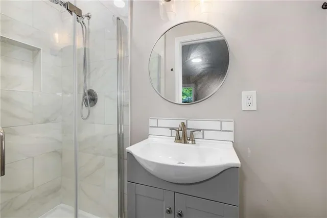 a bathroom with a sink and mirror