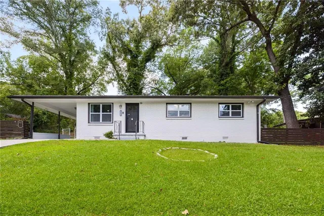 front view of a house with a yard