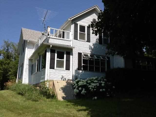 1124 South Forest Road Oregon, IL 61061 - Photo 4 of 7 a front view of a house with a garden