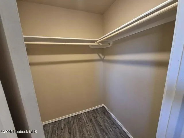 a view of a room with racks on the wall