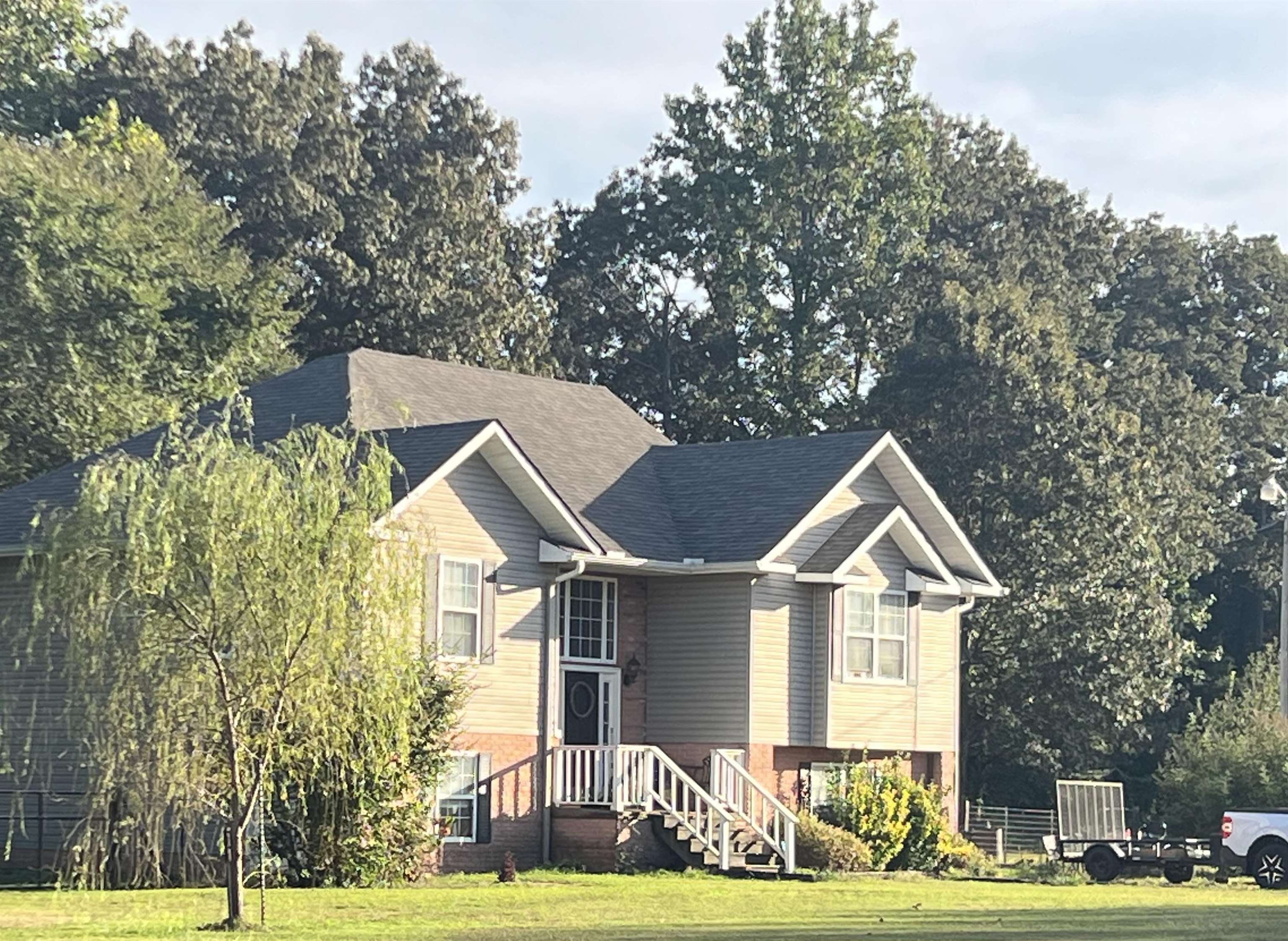 a front view of a house with a yard