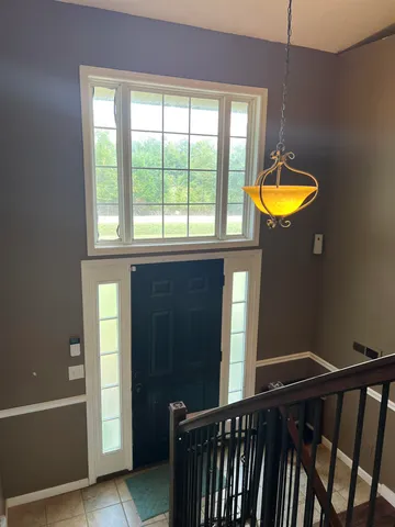 a view of a room with window and wooden floor