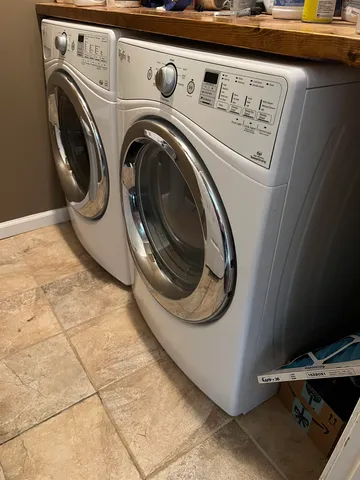 a bed room with a bed and a television