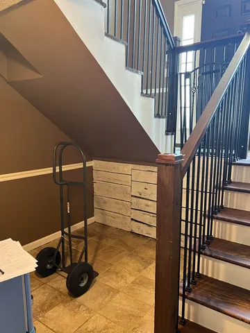 a living room with lots of furniture and clutter