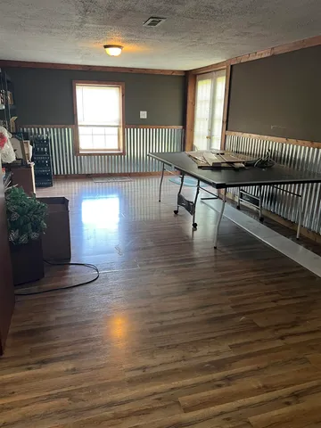 a view of a livingroom with furniture