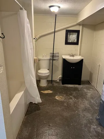 a bathroom with a bath tub and shower