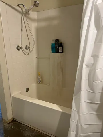 a bedroom with a bed and cabinets