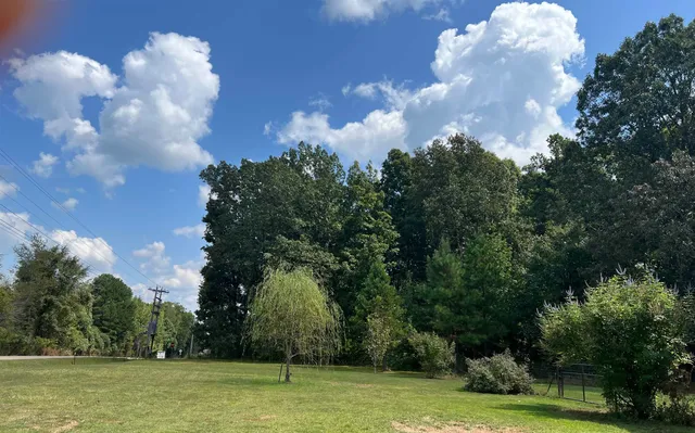 a view of a golf course with trees