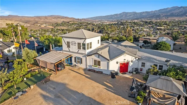 an aerial view of residential house with an outdoor space
