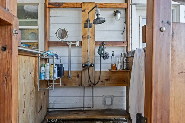 a living room with furniture a flat screen tv and a table
