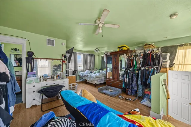 a bedroom with a bed and glass window