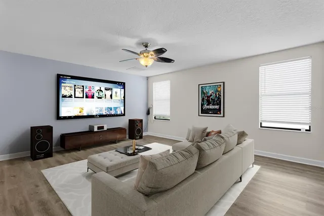 a bathroom with a granite countertop bathtub a double vanity sink and mirror