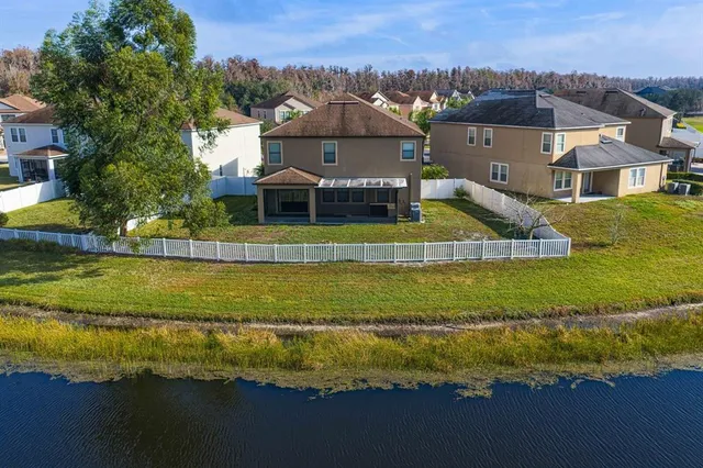 a view of a livingroom with furniture and a window