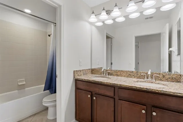 a view of a lake with houses in the back