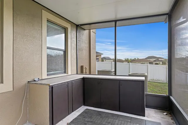 an aerial view of a house with a swimming pool yard and outdoor seating