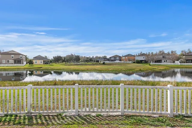 an aerial view of houses with yard