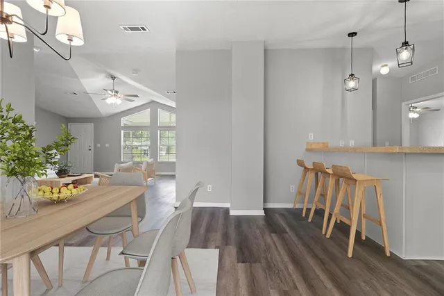 a kitchen with stove and cabinets