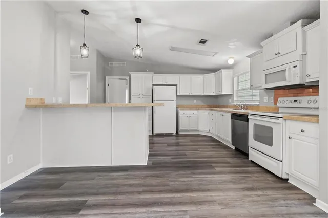 a bathroom with a granite countertop toilet sink and shower