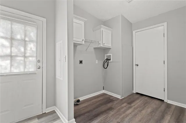 a view of a kitchen with wooden floor