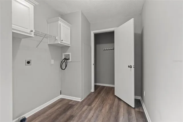 a view of an house with a porch and garden