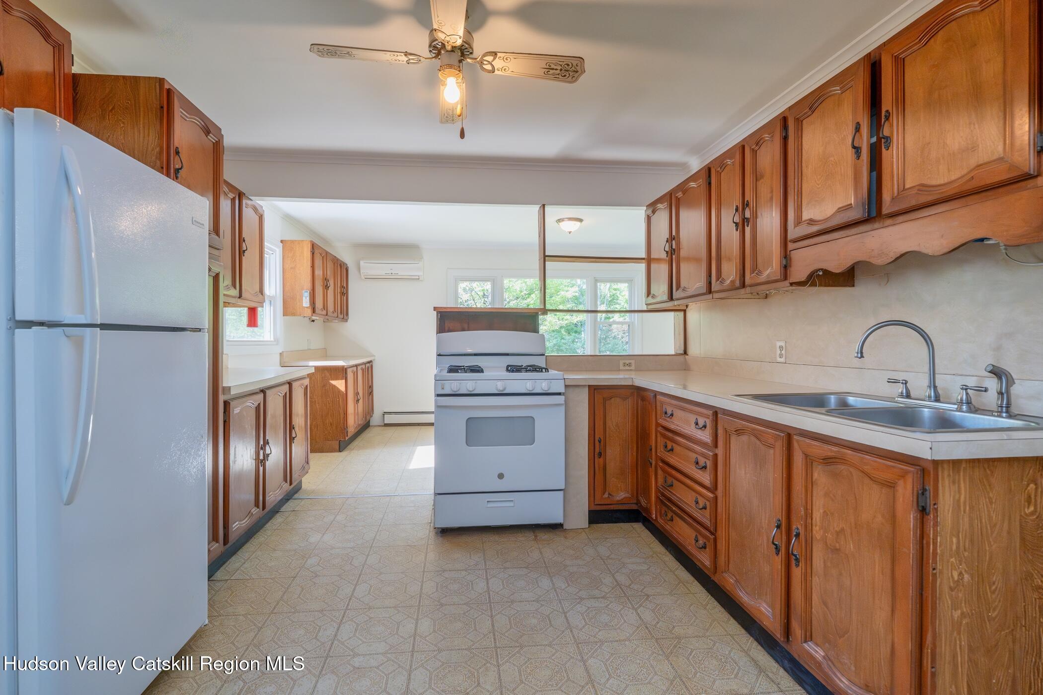 4533 Atwood Road Stone Ridge, NY 12484 - Photo 15 of 63 a kitchen with stainless steel appliances granite countertop a sink and cabinets
