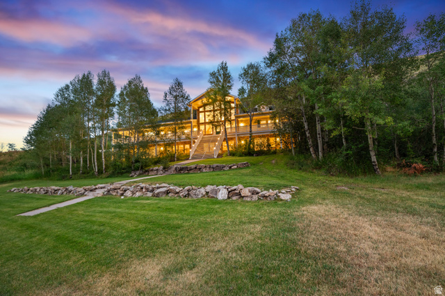 1133 Paris Canyon Road Paris, ID 83261 - Photo 71 of 74 Expansive hillside residence featuring a multi-story design with extensive glass facade and multiple balconies