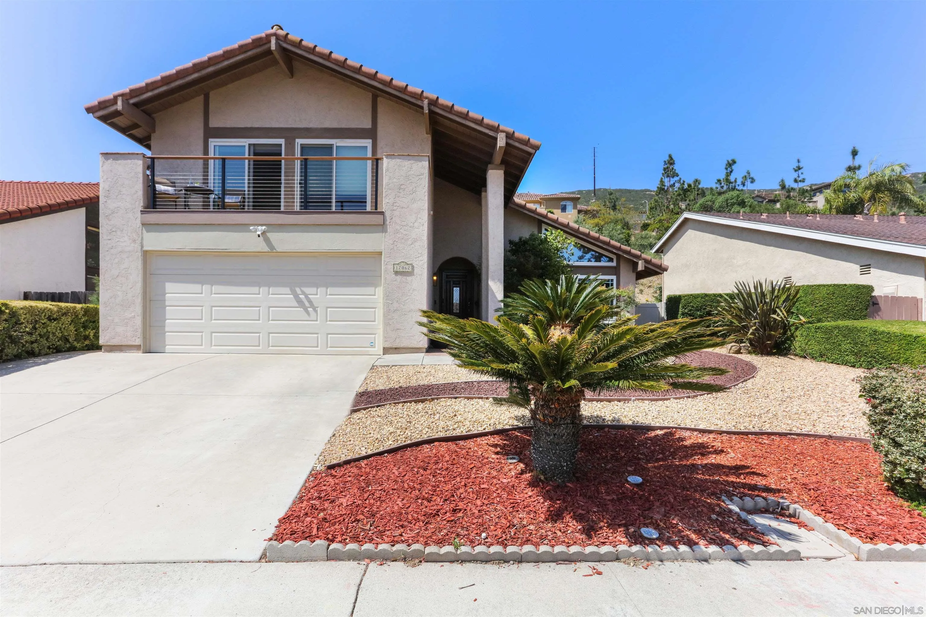 17062 Matinal Road San Diego, CA 92127 - Photo 1 of 42 a front view of a house with a yard