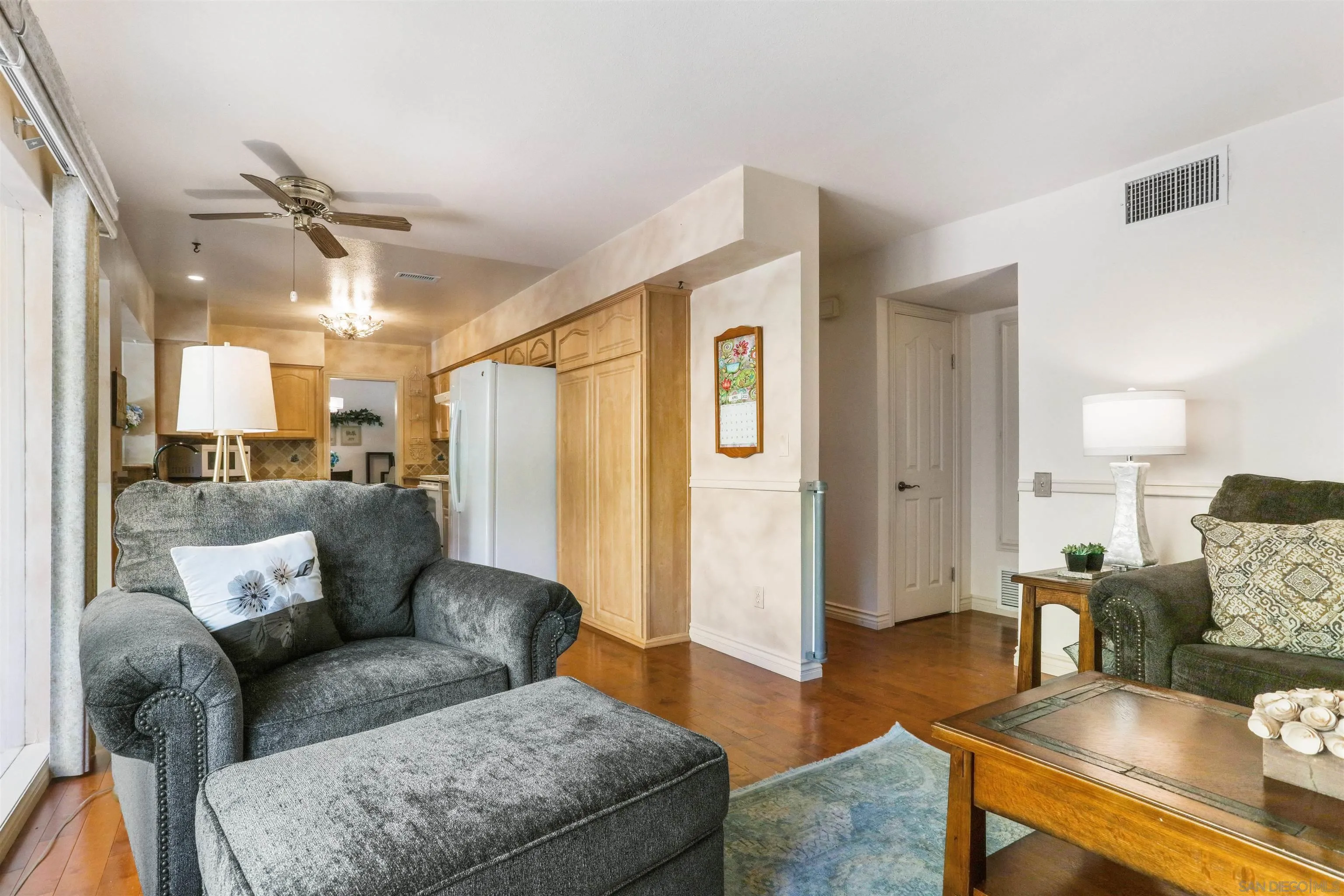 17062 Matinal Road San Diego, CA 92127 - Photo 14 of 42 a living room with furniture and a wooden floor