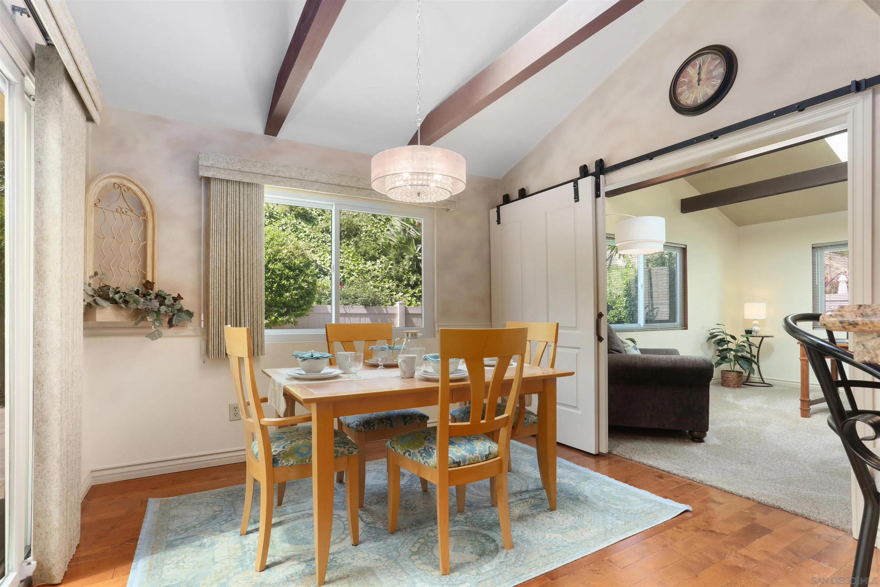 17062 Matinal Road San Diego, CA 92127 - Photo 19 of 42 a view of a dining room with furniture window and wooden floor