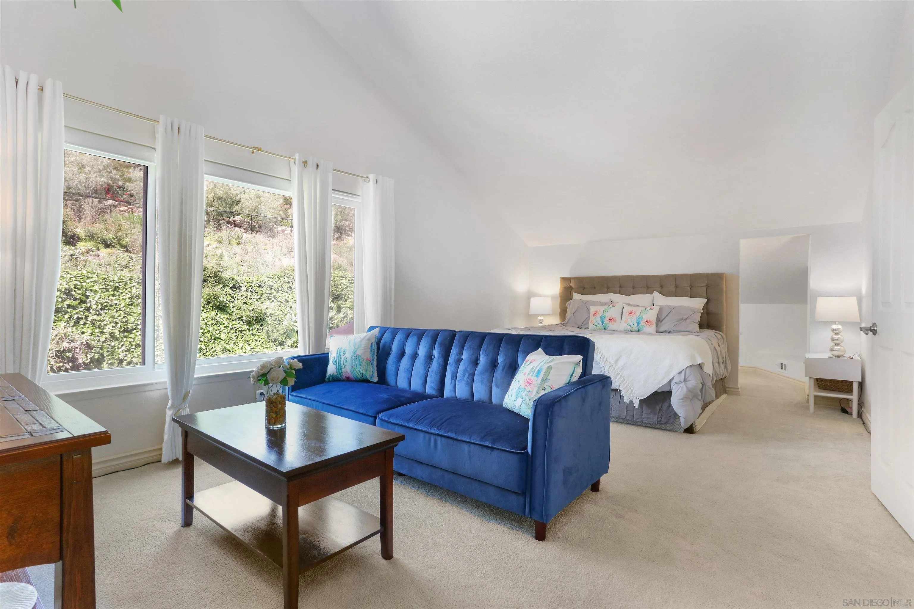 17062 Matinal Road San Diego, CA 92127 - Photo 24 of 42 a living room with furniture and a large window