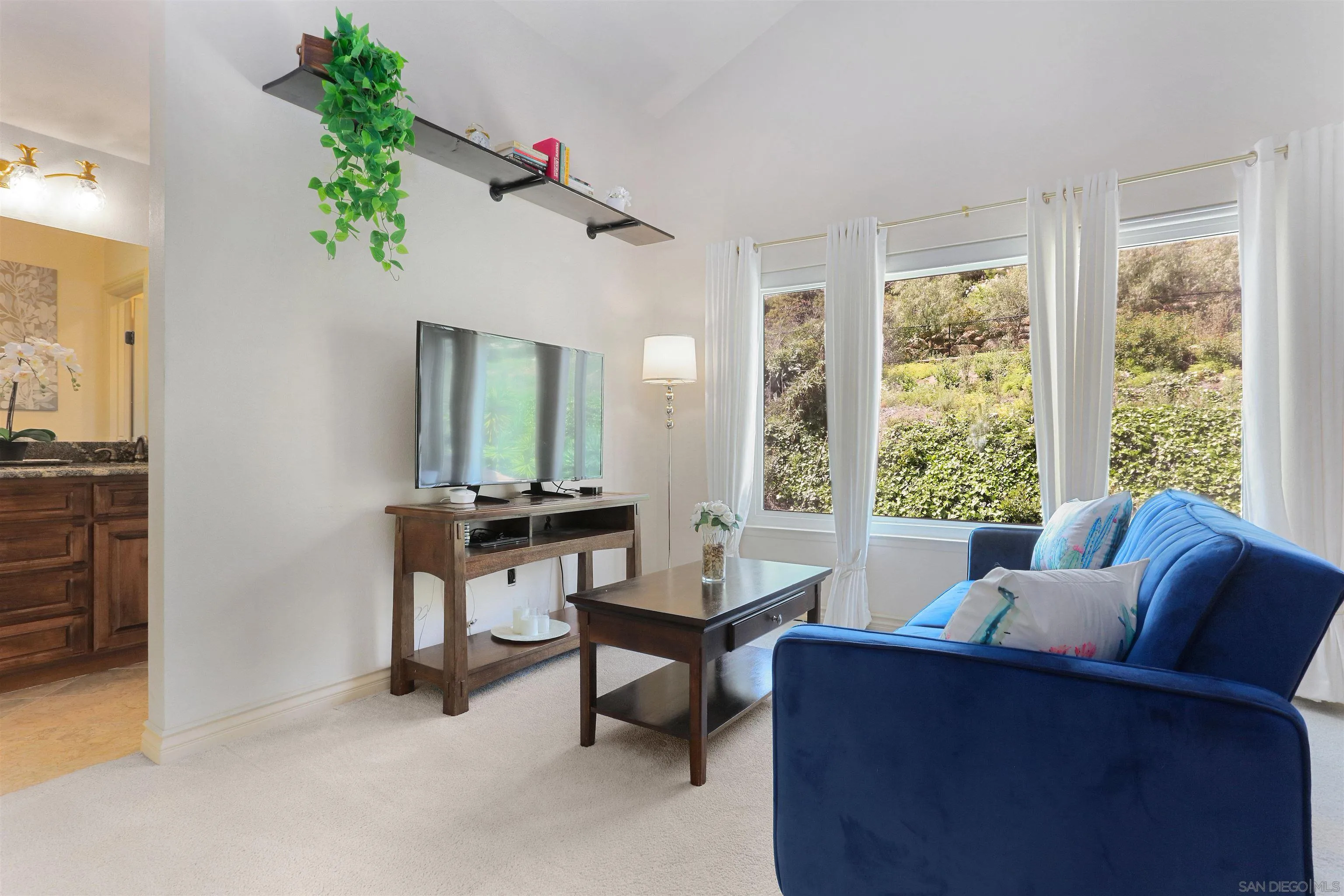 17062 Matinal Road San Diego, CA 92127 - Photo 26 of 42 a living room with furniture and a window