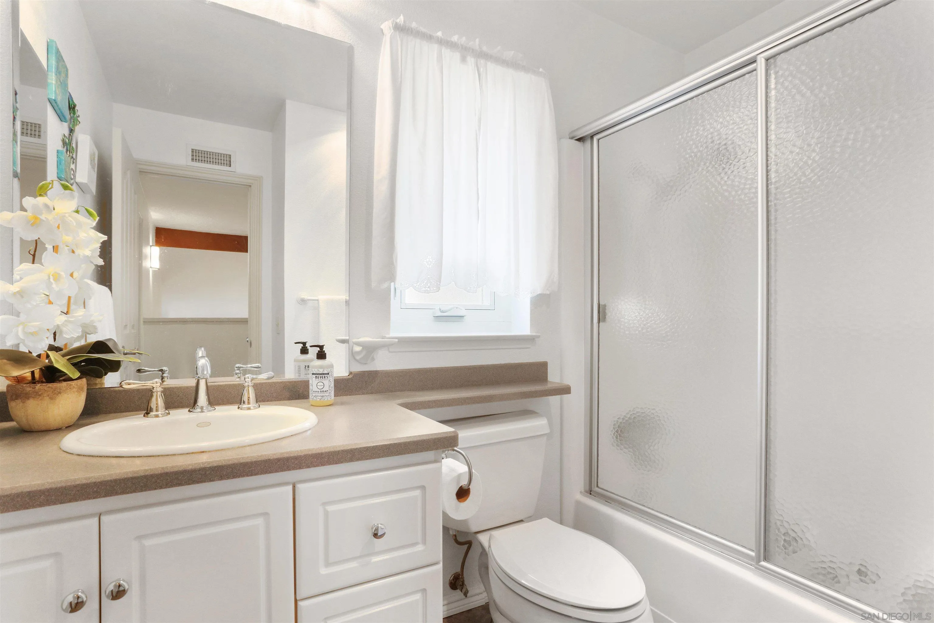 17062 Matinal Road San Diego, CA 92127 - Photo 29 of 42 a bathroom with a granite countertop sink a toilet and shower