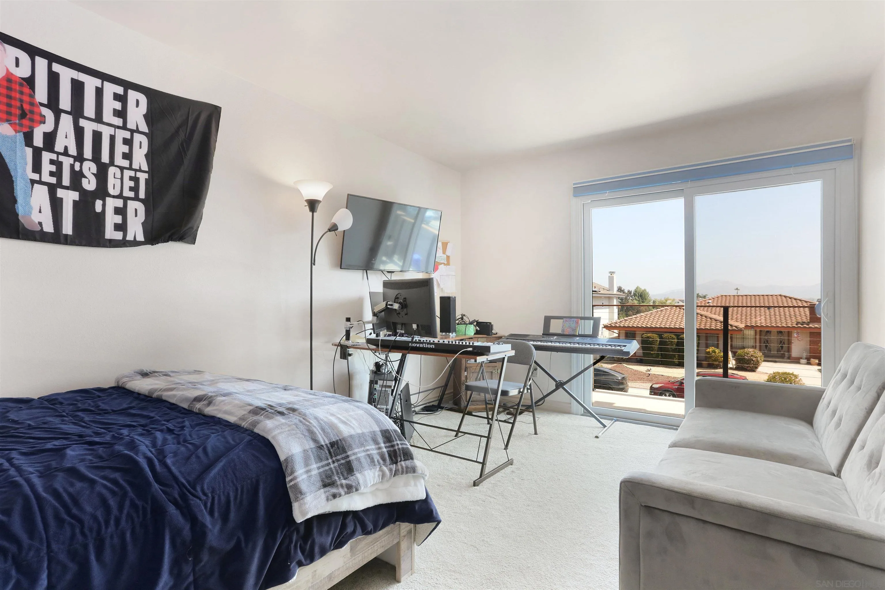 17062 Matinal Road San Diego, CA 92127 - Photo 30 of 42 a bedroom with a bed and wooden floor
