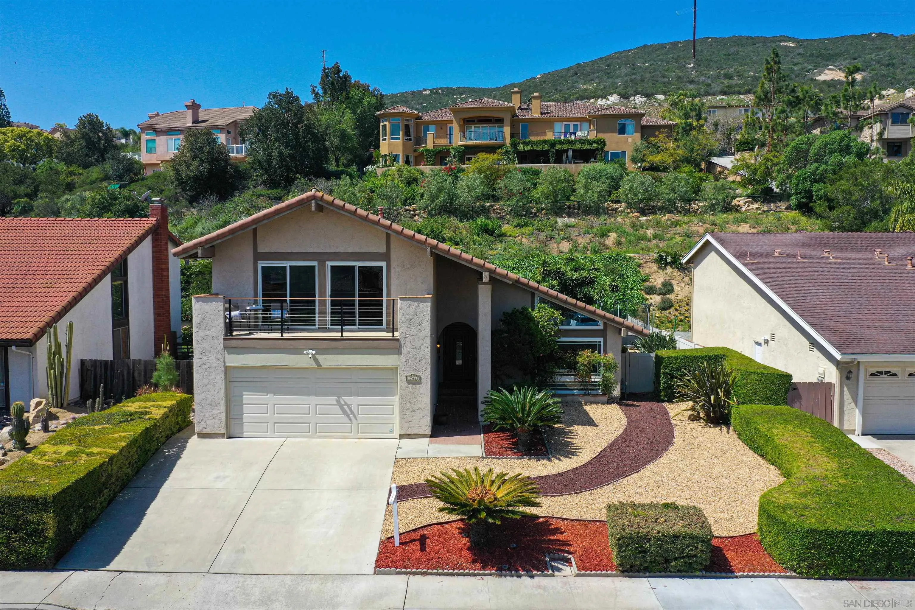 17062 Matinal Road San Diego, CA 92127 - Photo 3 of 42 a view of a house with backyard and sitting area