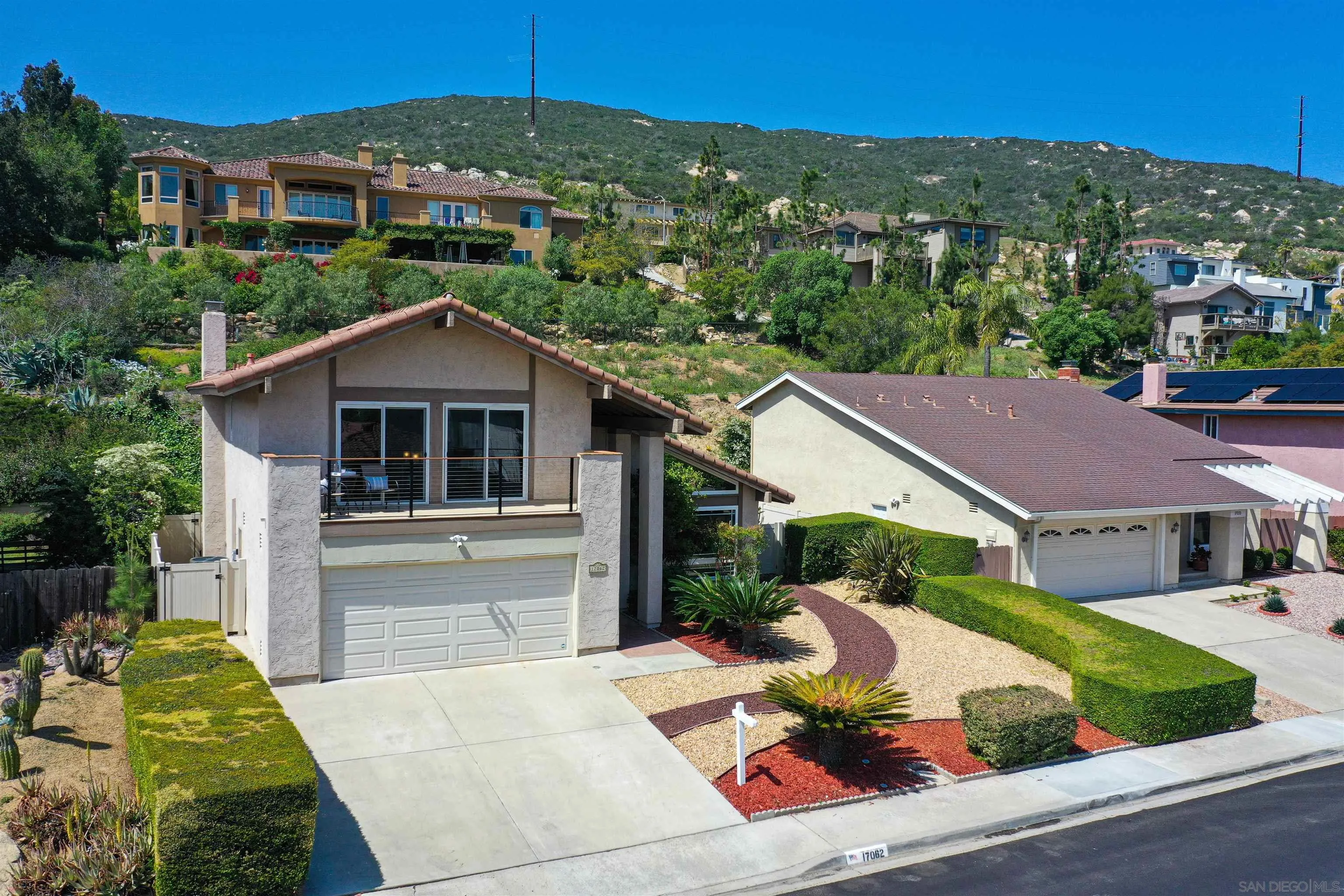 17062 Matinal Road San Diego, CA 92127 - Photo 4 of 42 a house with trees in the background