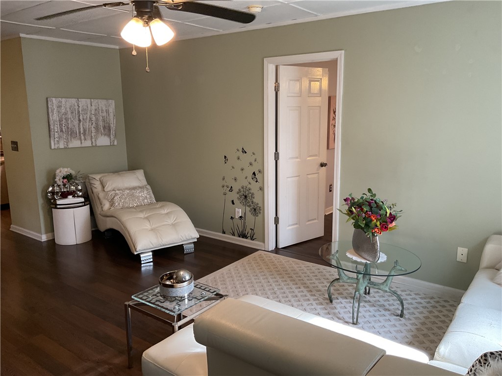 229 Cub Cove Drive Walhalla, SC 29691 - Photo 21 of 50 This inviting space features elegant hardwood flooring and ample natural light, creating a comfortable living area.