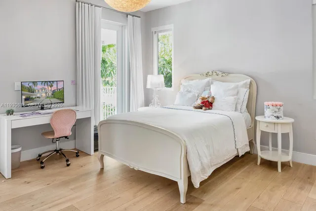 a bedroom with a bed chair and a window