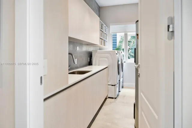 a hallway with stairs and a wooden floor