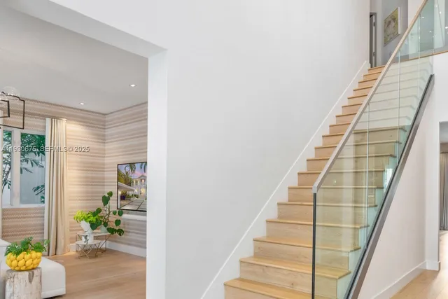 a view of staircase with white walls