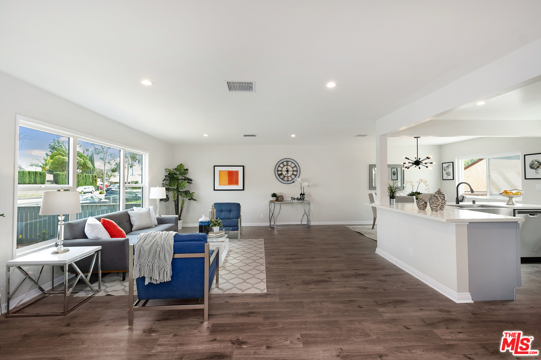 13927 Studebaker Road Norwalk, CA 90650 - Photo 2 of 27 a living room with furniture and a large window
