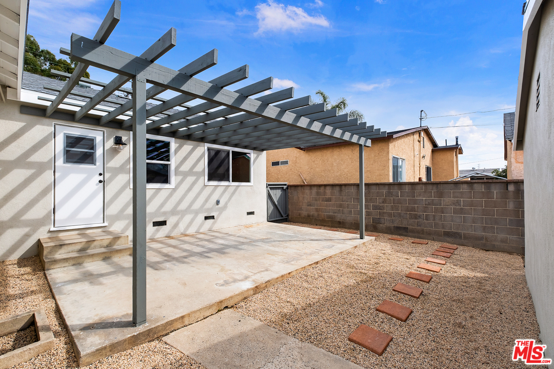 13927 Studebaker Road Norwalk, CA 90650 - Photo 23 of 27 a view of a backyard