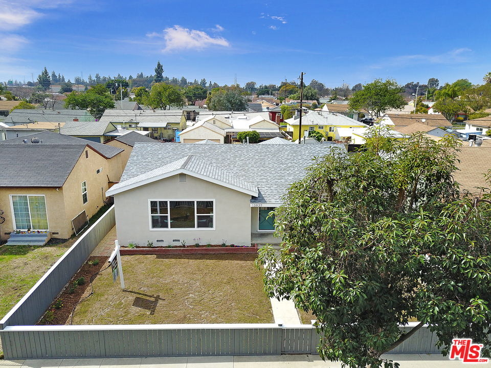 13927 Studebaker Road Norwalk, CA 90650 - Photo 26 of 27 a view of a house with a swimming pool