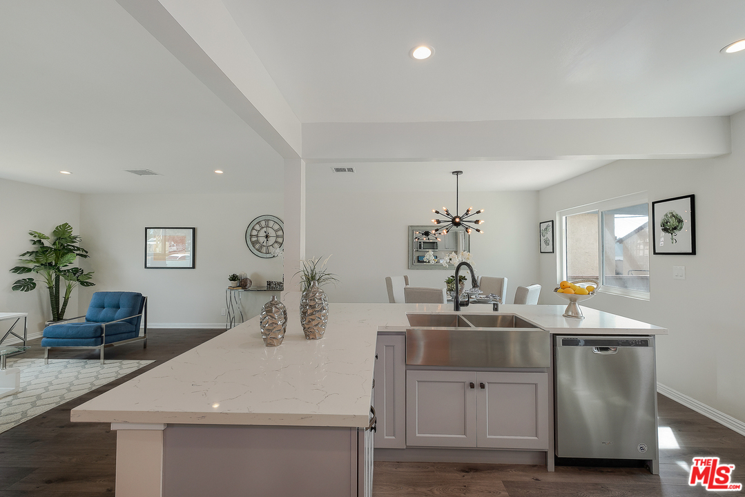 13927 Studebaker Road Norwalk, CA 90650 - Photo 9 of 27 a bathroom with a sink and a mirror