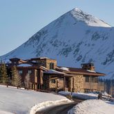 a front view of a house with parking space