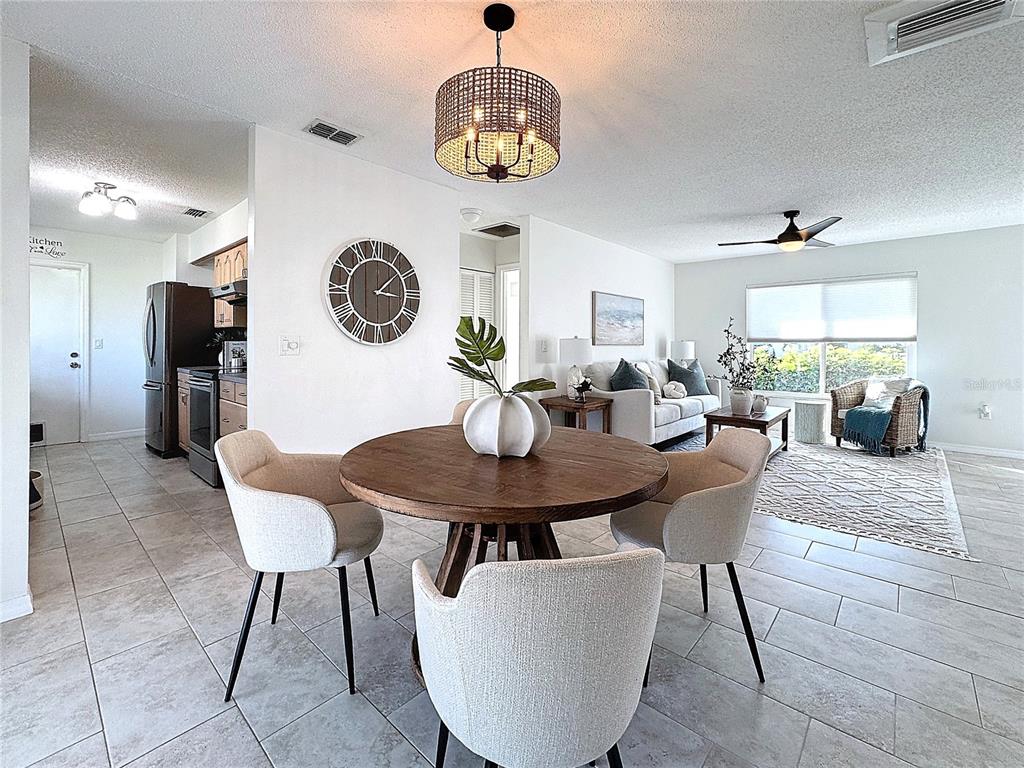5011 Mangrove Point Road Bradenton, FL 34210 - Photo 14 of 49 a view of a dining room with furniture