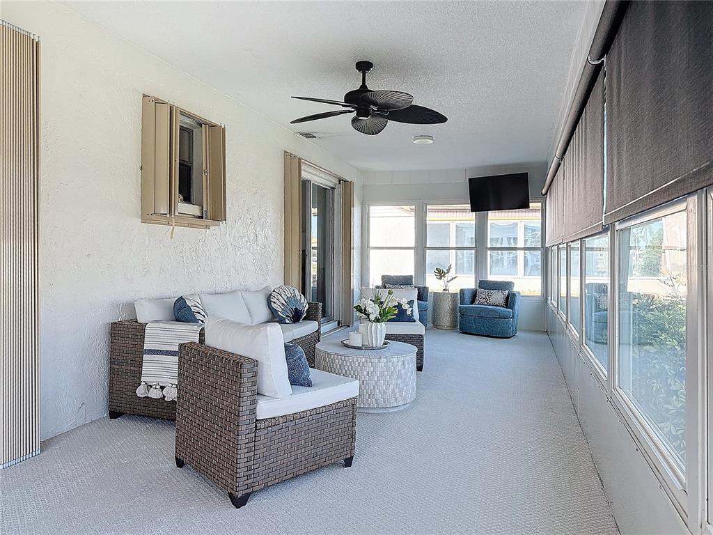 5011 Mangrove Point Road Bradenton, FL 34210 - Photo 19 of 49 a living room with furniture and a large window