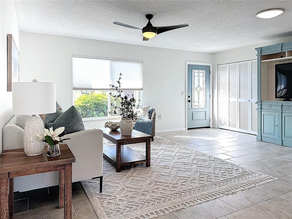 5011 Mangrove Point Road Bradenton, FL 34210 - Photo 26 of 49 a living room with furniture or couch and a window