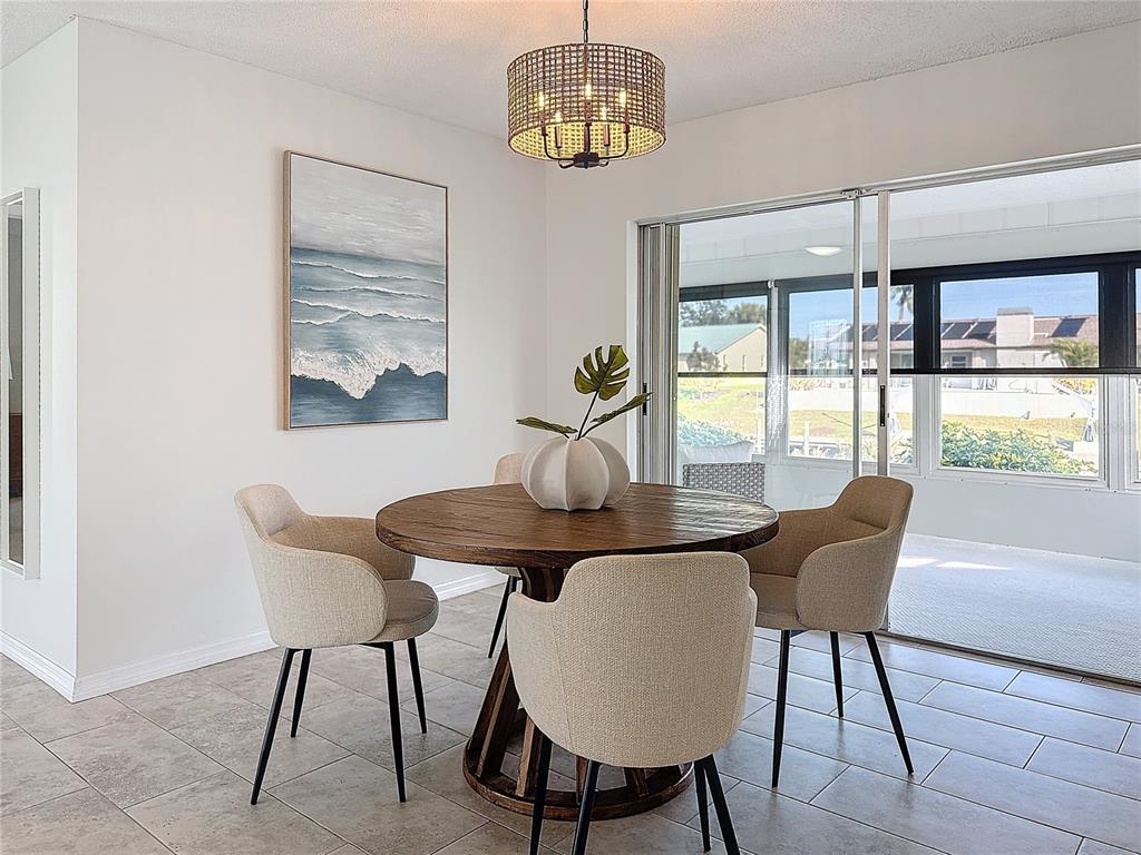 5011 Mangrove Point Road Bradenton, FL 34210 - Photo 27 of 49 a view of a dining room with furniture window and outside view